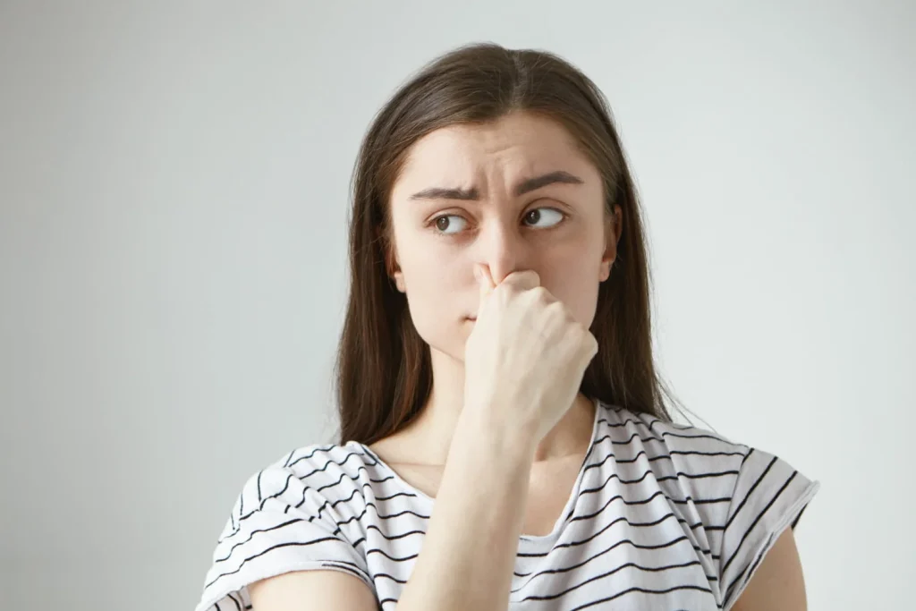 Lady Holding Nose Needing Odor Removal in Burbank, CA