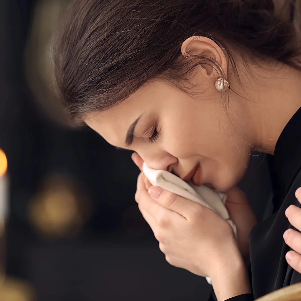 A woman grieving after a suicide in Buena Park, CA